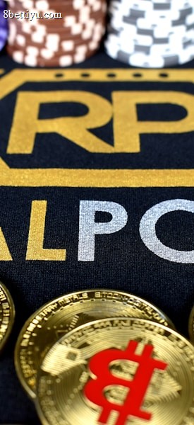 Stacks of poker chips in various colors are arranged in the background, while in the foreground, there are numerous golden coins featuring the Bitcoin symbol. The text 'REALPOKER' is prominently displayed in gold and silver lettering on a dark background.